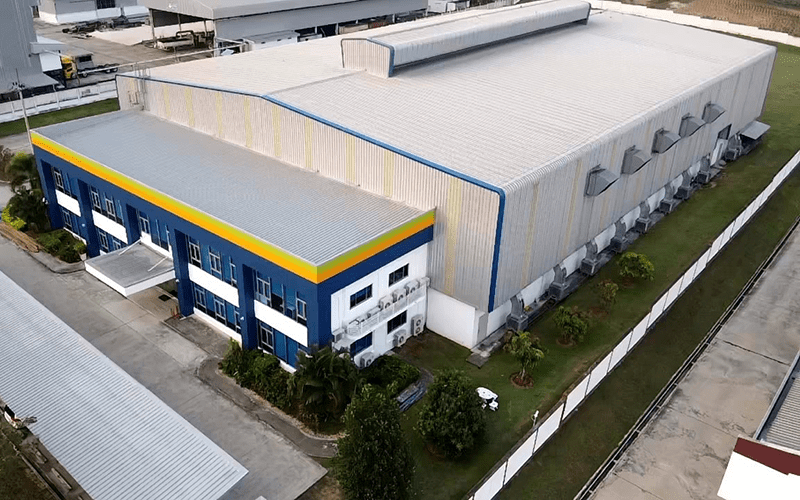 A areal view of a large building with a blue office area at the 180 Chonburi Thailand location.