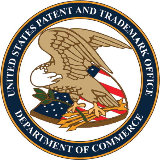 Patents logo. A large egale bird in the centre standing on a united states flag with arrows and a tree leaf in its feet. In the shape of a circle.